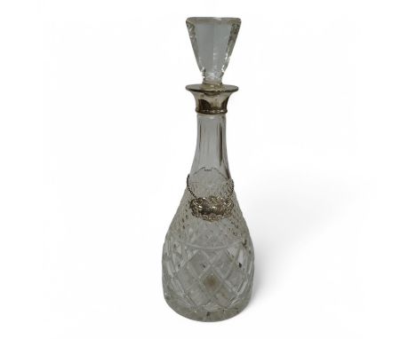 An early 1970's silver collared cut glass decanter and stopper,  London, 1972, height 37cm, together with a 1960's silver whi