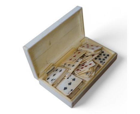 A scrimshaw carved bone miniature playing card set, 10.5cm wide. Condition - fair/good