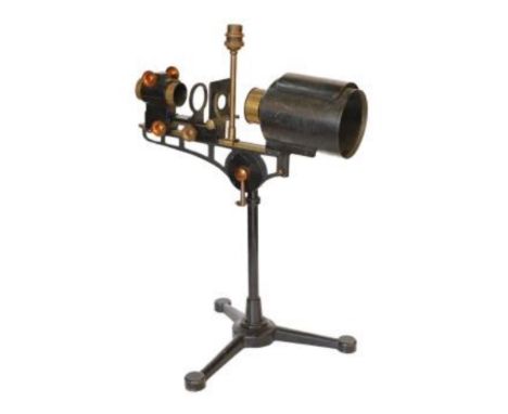 An early 20th century Hatters &amp; Garnett Ltd black lacquered and brass microscope slide projector table lamp (conversion),