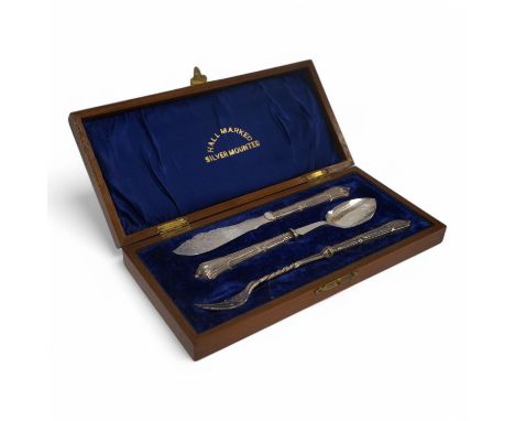 A cased Edwardian three piece silver handled plated cutlery set, comprising, a pickle fork, a preserve spoon and a butter kni