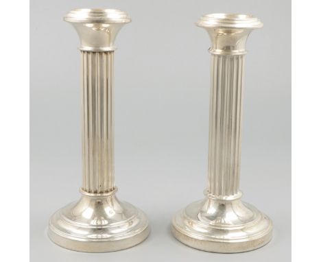 2-piece set of candlesticks silver. Beautiful set with pillar-shaped fluted trunk. Stuffed foot. 1 candlestick is only hallma