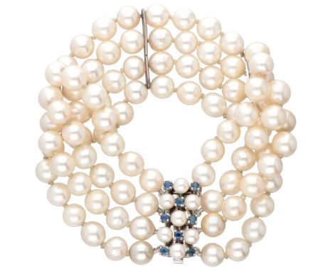 Vintage four-row freshwater pearl bracelet with a 14K. white gold closure set with natural sapphire and pearls. Hallmarks: 58