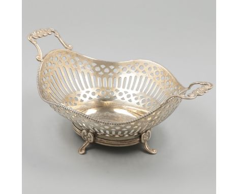 Silver bonbon basket. Beautiful oval model with soldered handles and pearl edge decoration. The sides are partly openwork ope