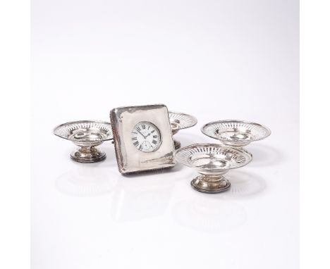 A SET OF FOUR SILVER SWEETMEAT DISHES, circular shaped with pierced decoration and charged circular stepped feet, 11cm diamet