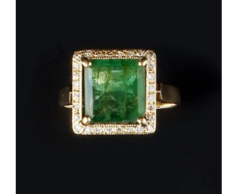 AN EMERALD AND DIAMOND CLUSTER RING, the square step-cut emerald claw set within a brilliant-cut diamond border, yellow preci