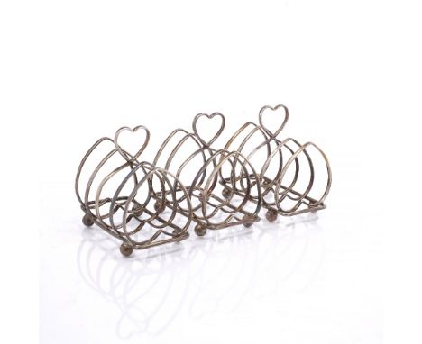 A SET OF THREE SILVER FOUR DIVISIONAL HEART SHAPED TOAST RACKS, 9.5cm long, Sheffield 1922 by Harrison Bros & Howson, 8 ozs