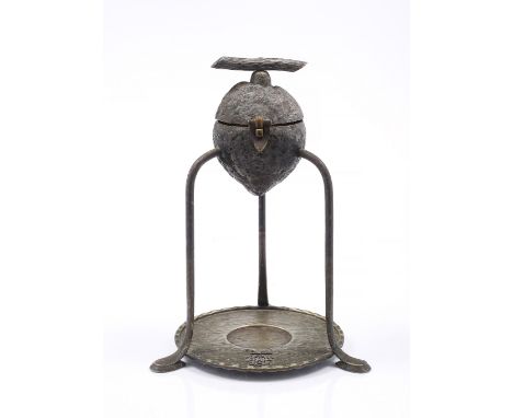 A HUKIN AND HEATH SILVER PLATED LEMON SQUEEZER of naturalistic form on three splayed legs and with applied monogram, stamped 