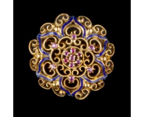 A RUBY AND ENAMEL PANEL BROOCH, of openwork rosette design, centred with a cluster of circular mixed-cut rubies, framed by a 