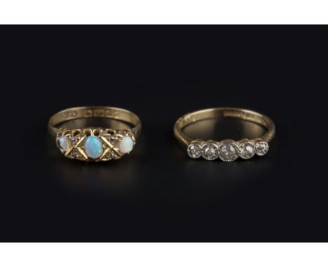 TWO GEM SET RINGS, comprising an opal and diamond half hoop ring, 18ct gold mounted, and a diamond five stone ring, stamped '