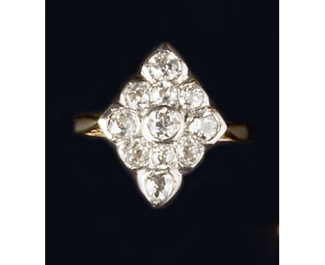 A DIAMOND PANEL RING, the navette-shaped panel set with graduated old-cut diamonds, two colour precious metal mounted, stampe