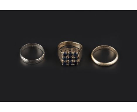 THREE RINGS, comprising a square sapphire cluster ring, and two wedding bands, each 9ct gold mounted, first ring size N (3) 