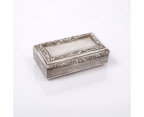 A WILLIAM IV CHASED SILVER SNUFF BOX with silver gilt interior, Birmingham 1834 by Francis Clark, 7.5cm, 3.5 ozs