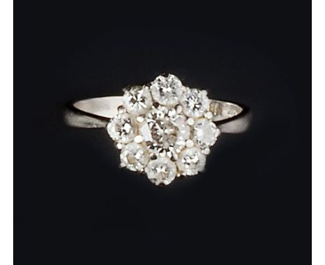 A DIAMOND CLUSTER RING, the flowerhead cluster of round brilliant-cut diamonds in claw setting, white precious metal mounted,