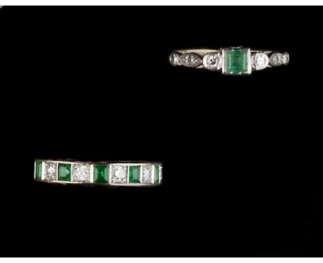 TWO EMERALD AND DIAMOND SET RINGS, the first a half hoop ring, alternately set with square step-cut emeralds and brilliant-cu