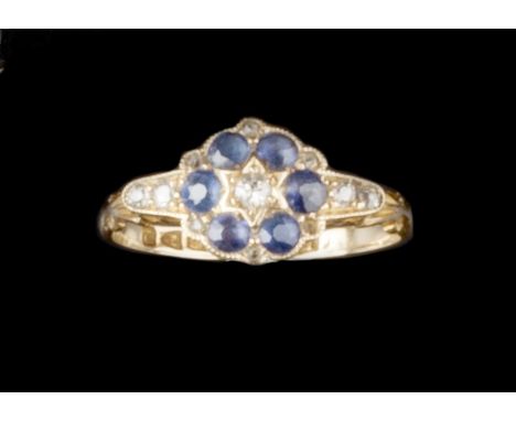 A SAPPHIRE AND DIAMOND CLUSTER RING, millegrain set with circular mixed-cut sapphires and old-cut diamonds, spaced by lasque-