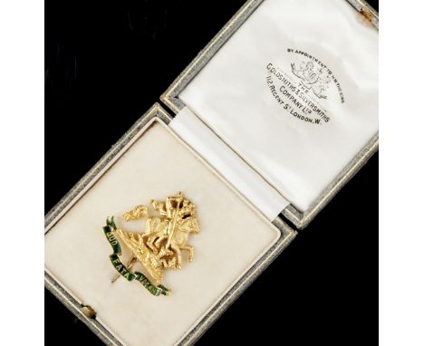 A REGIMENTAL BROOCH FOR THE ROYAL NORTHUMBERLAND FUSILIERS, depicting St George and the Dragon, above green enamel motto 'Quo