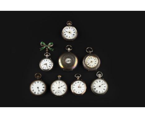 A COLLECTION OF EIGHT FOB WATCHES, of varied form, to include an example with green enamel ribbon bow brooch fitting (8)