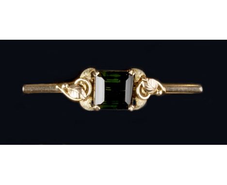 FOUR BROOCHES, comprising a green tourmaline set bar brooch, the square step-cut tourmaline claw set between foliate shoulder