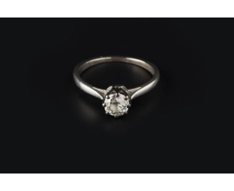 A DIAMOND SINGLE STONE RING, the old brilliant-cut diamond in eight claw setting, white precious metal mounted, stamped 'plat