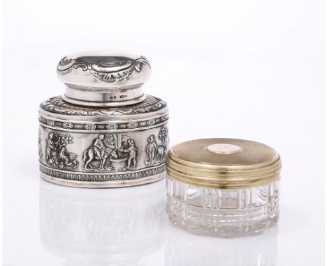 A CONTINENTAL .925 SILVER OVAL TEA CADDY AND COVER with embossed rural figures, 7.4cm high and a cut glass dressing bottle wi