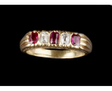 A RUBY AND DIAMOND FIVE STONE RING, alternately set with oval mixed-cut rubies and cushion-shaped diamonds, between fluted sh