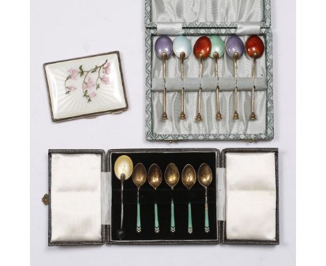 A SILVER AND ENAMEL CIGARETTE CASE, the cover decorated with a spray of pink magnolia blooms on a white ground, Birmingham 19