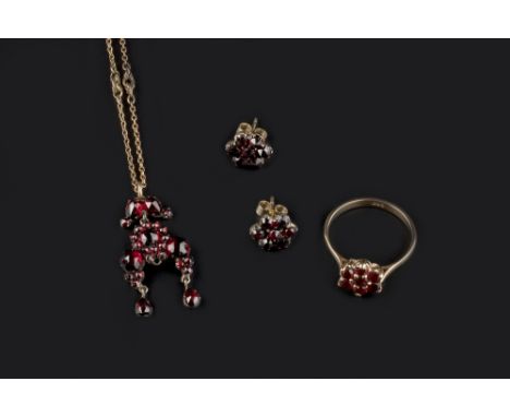 A SMALL COLLECTION OF GARNET JEWELLERY, comprising a Bohemian garnet pendant (adapted, central drop deficient), suspended fro