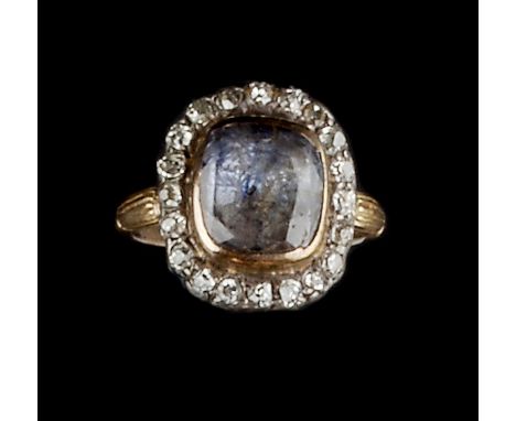 A GEORGIAN SAPPHIRE AND DIAMOND PANEL RING, the cushion-shaped mixed-cut sapphire in foiled closed-back setting, framed by a 