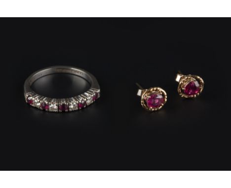 A RUBY AND DIAMOND HALF HOOP RING, alternately claw set with circular mixed-cut rubies and round brilliant-cut diamonds, 18ct