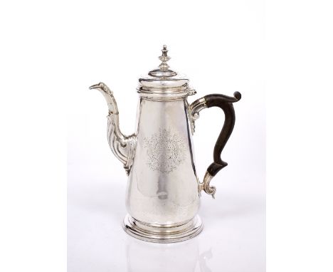 A GEORGE II SILVER COFFEE POT of tapering form standing on a turned stepped foot, shell decorated, spout domed hinged lid wit