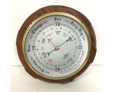 A mid 20thc. wall barometer, with circular dial, marked Shortland Instrument (d.27cm)
