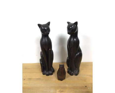 A pair of ceramic Art Deco style cats (each: 33cm) and a carved wooden cat (11cm) (3)