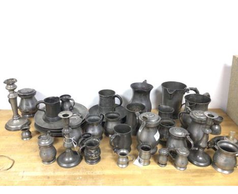 A quantity of pewter including candlesticks, tankards, measures, jugs (candlestick: 21cm), some with Imperial pint stamps to 