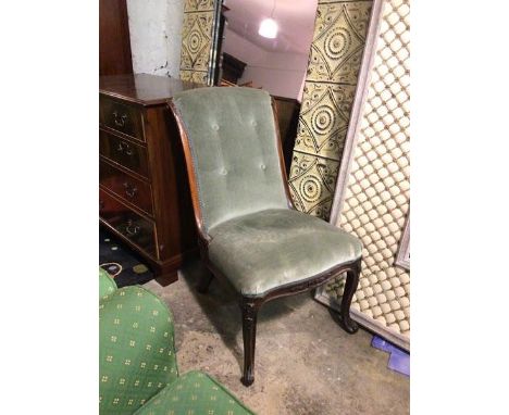 A 19thc rosewood low chair with scrolled button back, on moulded serpentine front and cabriole supports (86cm x 52cm x 81cm)