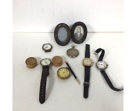 A pair of Edwardian Birmingham silver oval photograph frames, with C scroll decoration (9cm x 6cm) and a collection of pocket