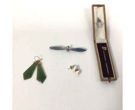 A Hamilton &amp; Inches yellow metal stick pin with a Fox head finial, in original box (pin: 6cm) and two polished green ston