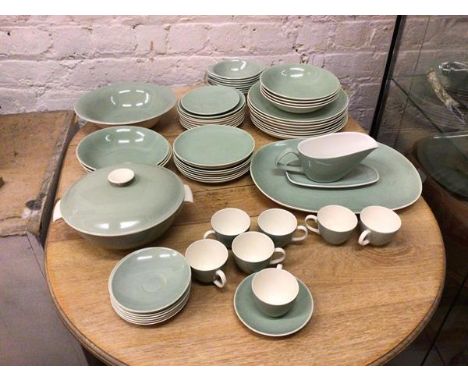 A part Poole dinner service in celadon green including eight dinner plates (26cm), seven demi tasse cups with saucers, lidded