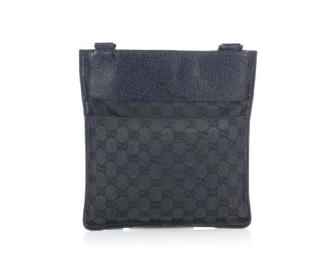 Gucci, a black messenger bag, designed with maker's black GG monogram canvas exterior and grained black leather trim, featuri