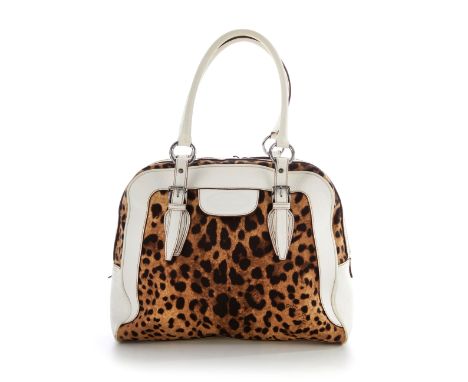 Dolce & Gabbana, a Dome satchel, designed with a leopard pint canvas exterior and cream leather trim, rolled leather handles 