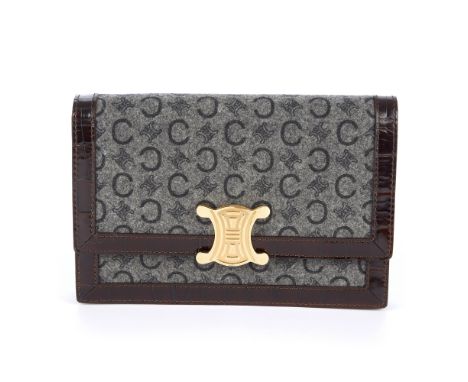 Celine, a Triomphe clutch, designed with a grey felt exterior featuring marker's logo throughout and crocodile embossed brown