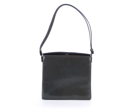 Gucci, a smooth leather square handbag, designed with a structured shape, featuring a thin adjustable top handle and a snap b