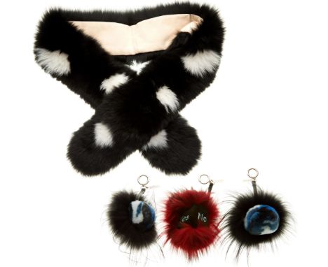 A black and white fox fur scarf and three fox fur pom-pom keyring charms, labelled 5th Story London, with maker's dust bag an