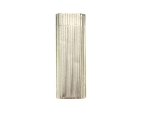 Cartier, a silver plated lighter, featuring a ribbed body, signed Cartier, measuring 2.5 by 7cm, total weight 90gCondition- O