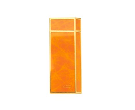 Cartier, a Must De Cartier enamel lighter, designed with a gold plated metal and orange enamel body, weight 76g, with maker's