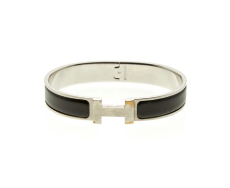 Hermes, a Clic H bracelet, the hinged black enamel bangle with clasp concealed behind maker's H logo, signed Hermes, inner di