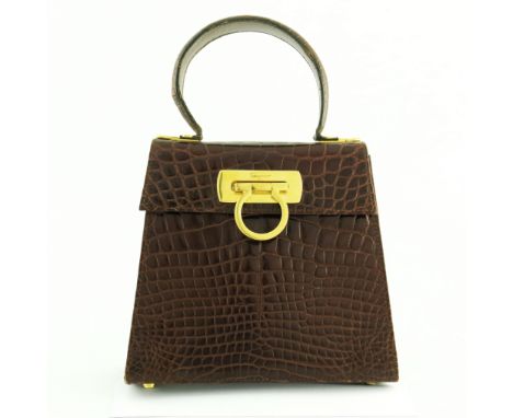 Salvatore Ferragamo, a crocodile Gancini Top Handle handbag, crafted from luxurious glossy brown crocodile skin, featuring a 