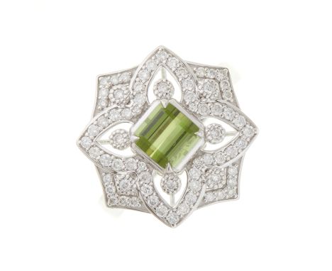 An 18ct gold green tourmaline and brilliant-cut diamond openwork dress ring, with tapered shoulders, tourmaline weight 1.015c