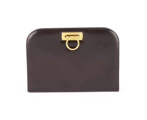 Salvatore Ferragamo, a Gancini handbag, featuring a smooth brown leather exterior, with polished gold-tone hardware to includ