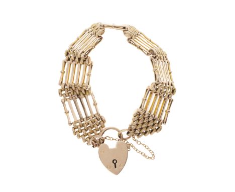 An early 20th century 9ct gold textured and polished gate bracelet, with heart-shape padlock clasp, stamped 9ct, length 21cm,