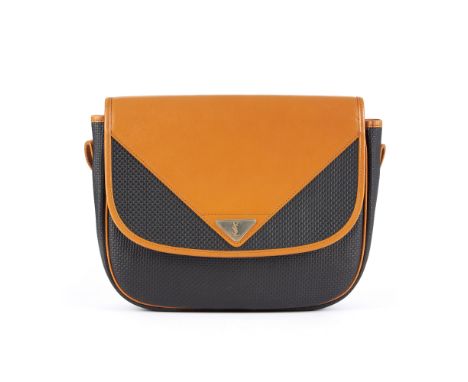 Yves Saint Laurent, a vintage flap handbag, featuring a navy blue coated woven canvas exterior with smooth tan leather trim, 